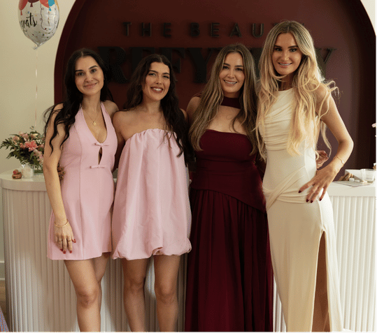 Group of women posing together at a professional event