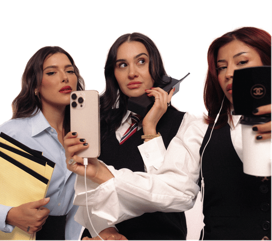 Three women creating social media content with smartphones